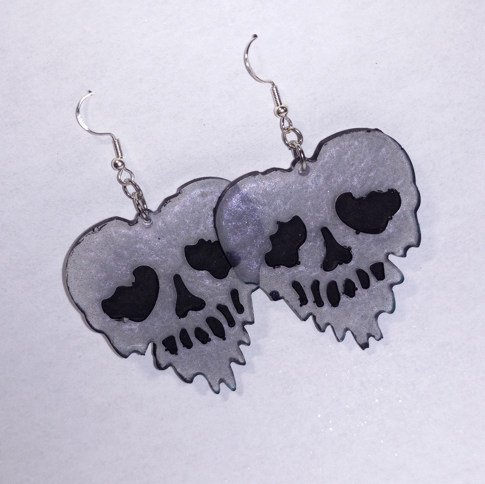 Iridescent melting skull earrings